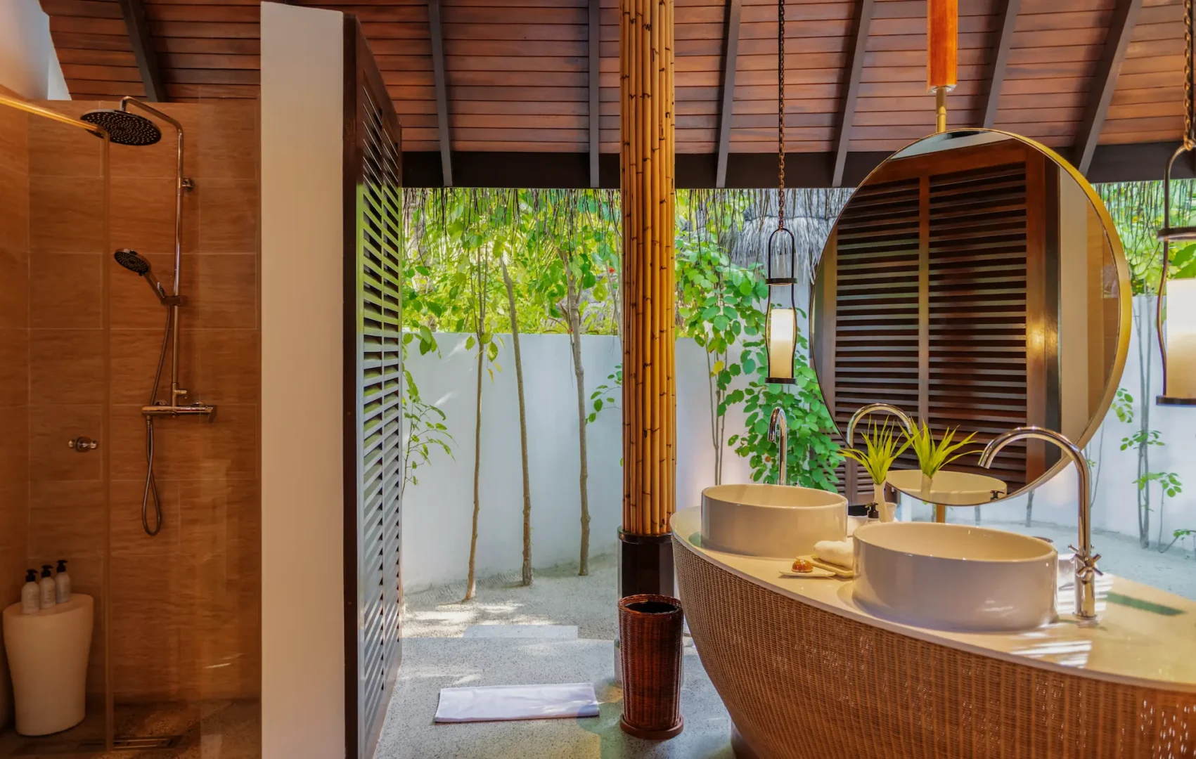 constance halaveli maldives beach villa two bedrooms featuring a stylish outdoor shower area