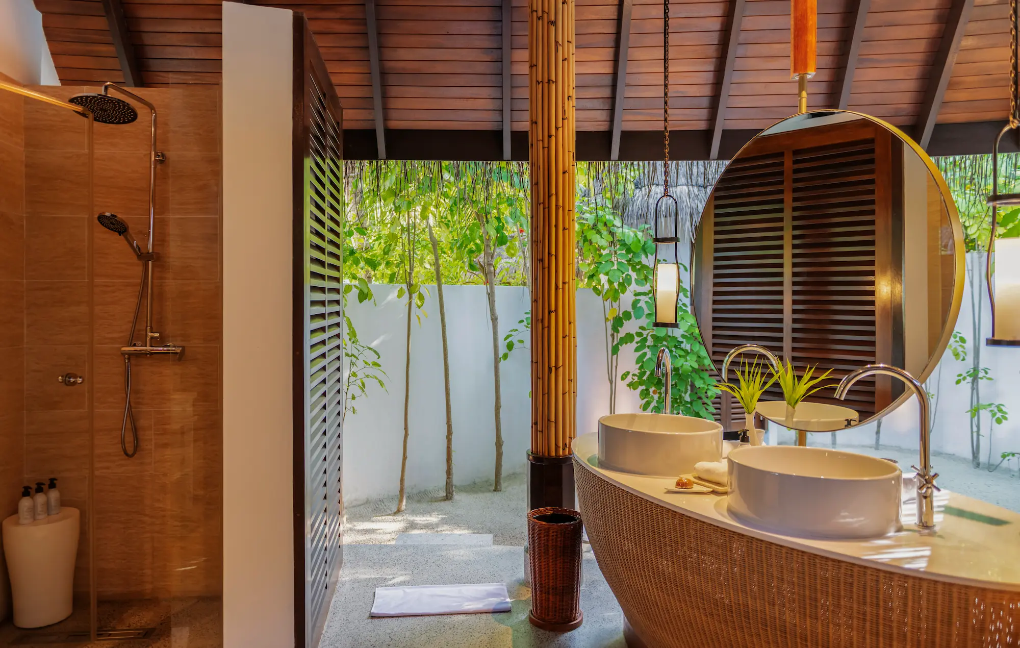 constance halaveli maldives beach villa two bedrooms featuring a stylish outdoor shower area