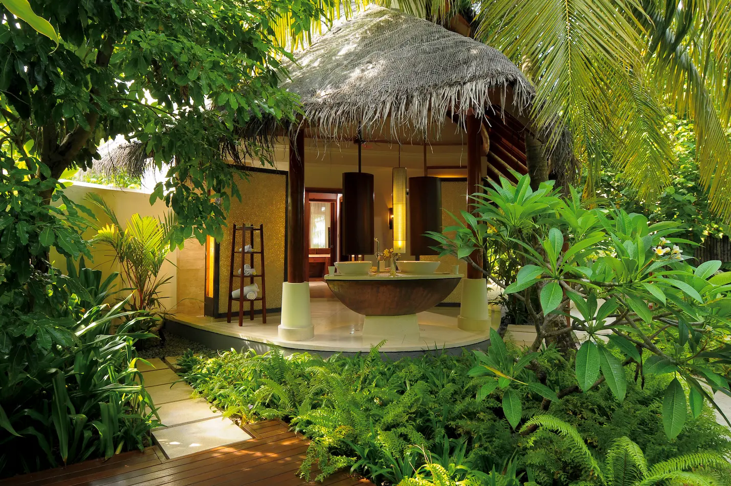 constance halaveli maldives double storey beach villa featuring a bright and elegant bathroom area