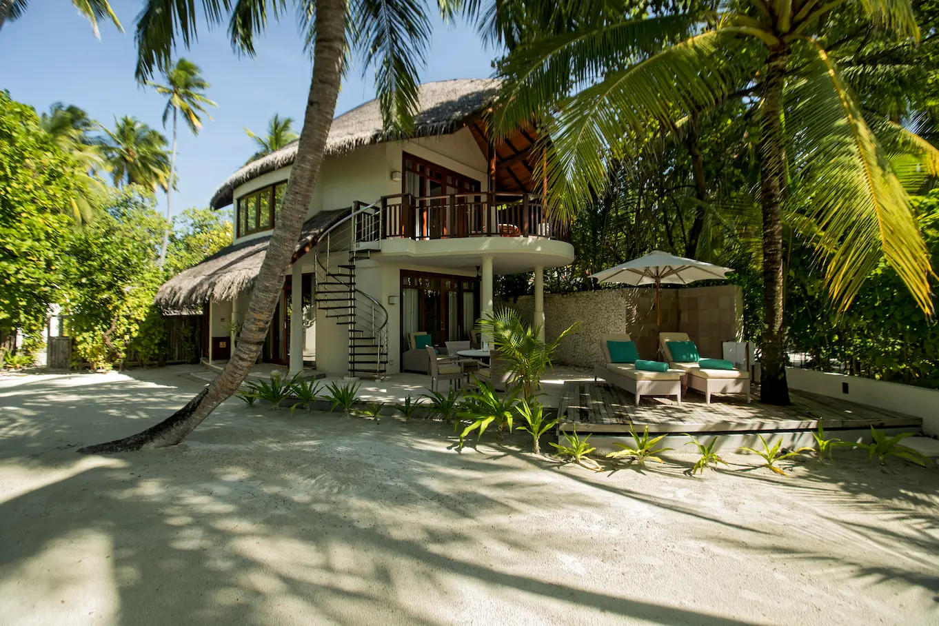 constance halaveli maldives double storey beach villa showcasing a bright and spacious exterior view