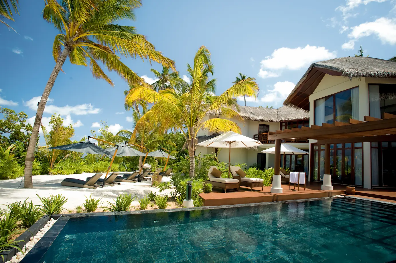 constance halaveli maldives presidential villa featuring a relaxing sunbed area