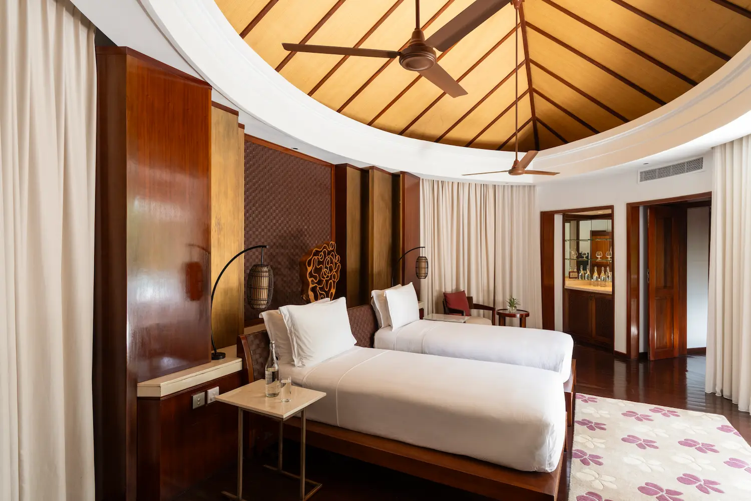constance halaveli maldives presidential villa featuring a bright and comfortable twin bedroom