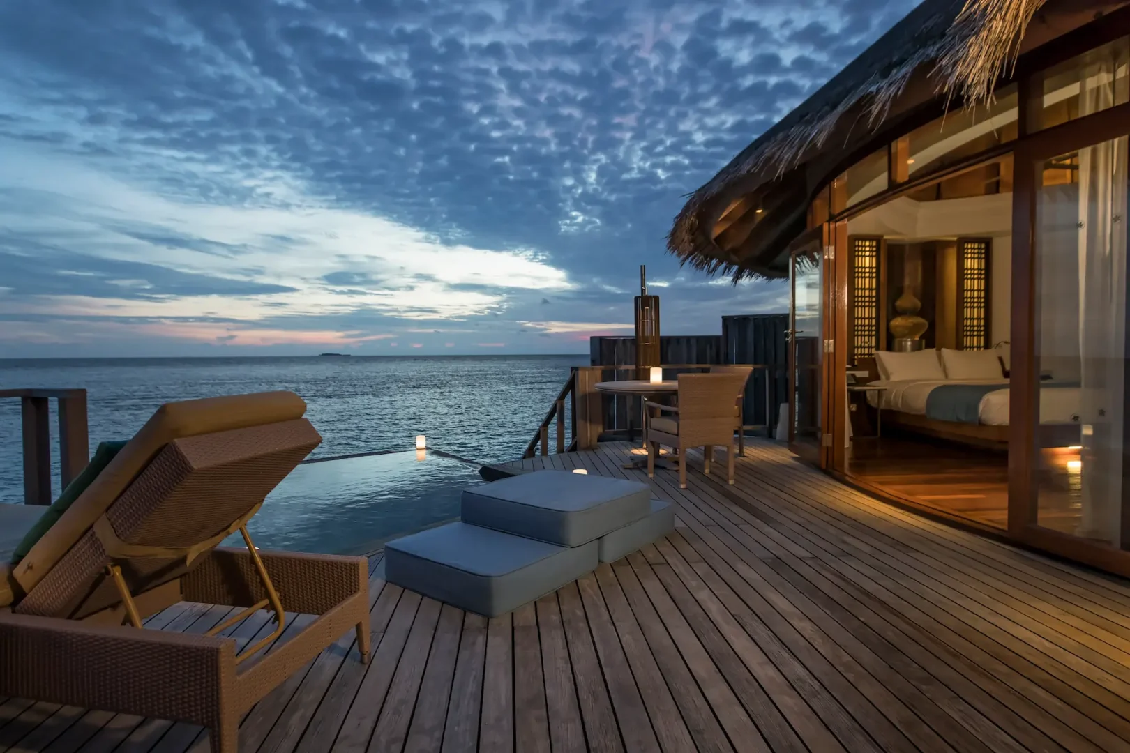 constance halaveli maldives water villa featuring a relaxing balcony retreat