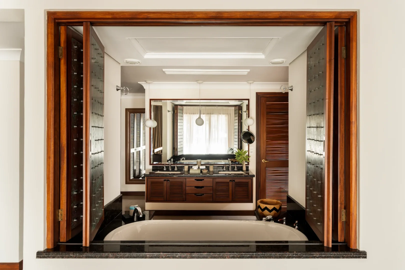 constance lemuria presidential villa bathroom with bathtub shower and luxurious tropical design