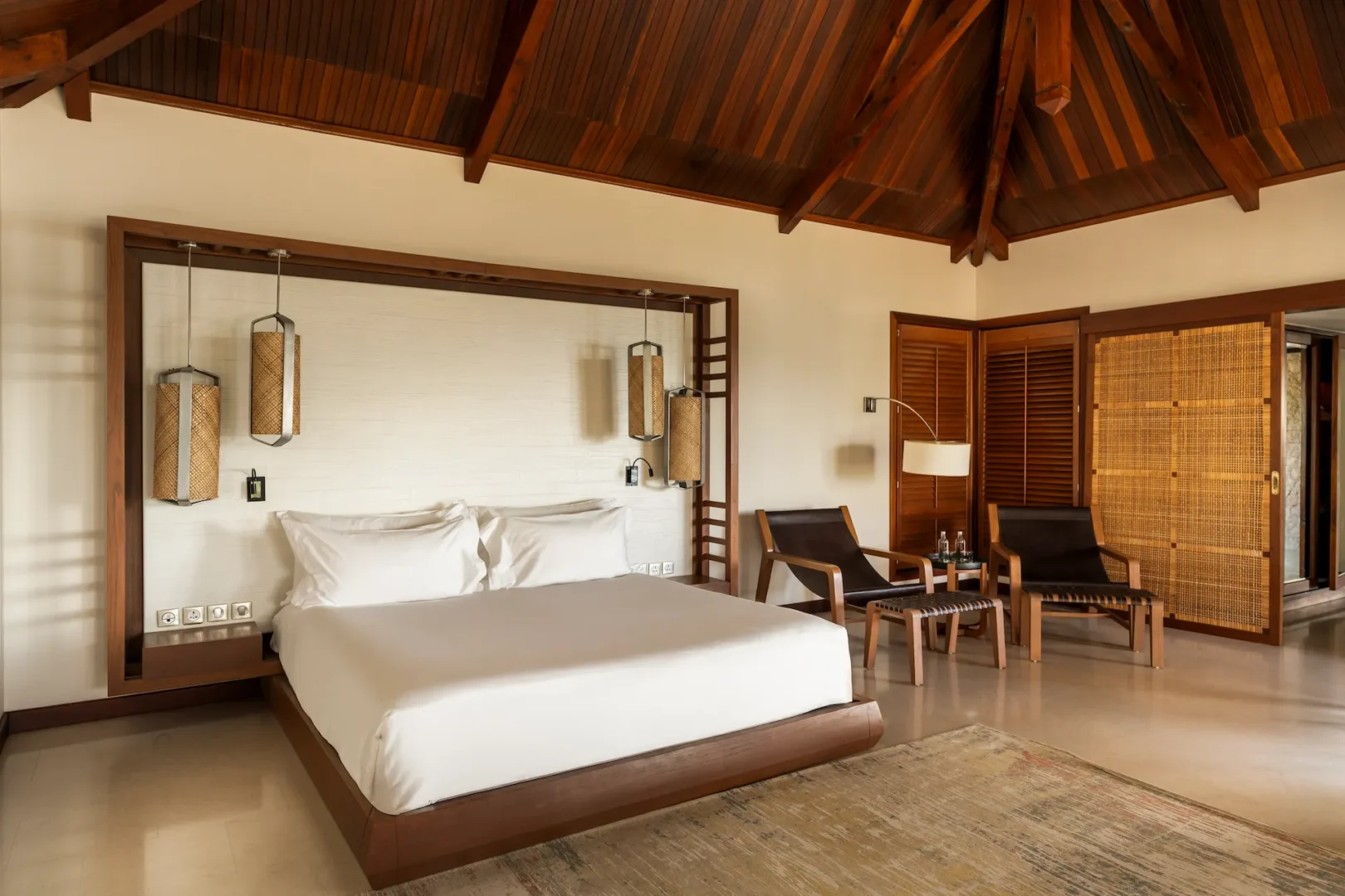 constance lemuria presidential villa bedroom with king bed and luxurious tropical decor