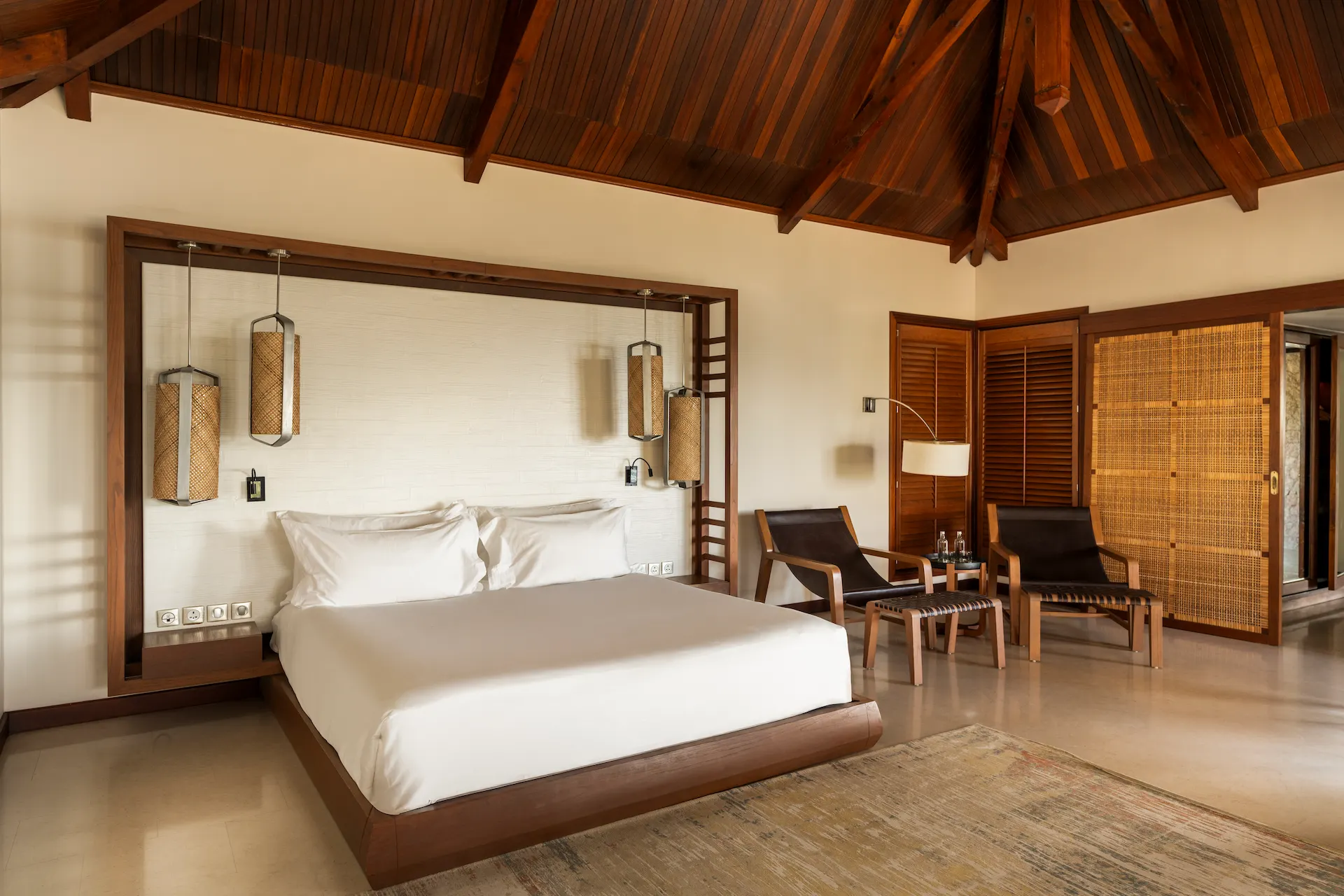 constance lemuria presidential villa bedroom with king bed and luxurious tropical decor