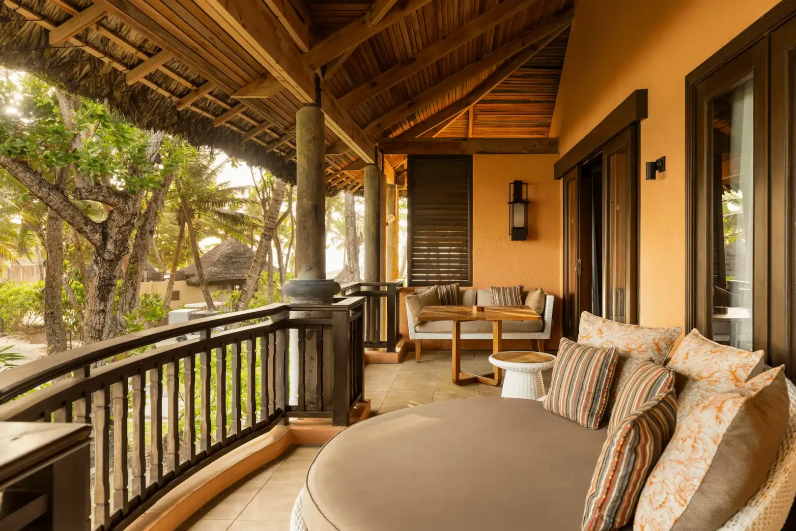 constance lemuria senior suite balcony overlooking ocean and lush tropical landscape