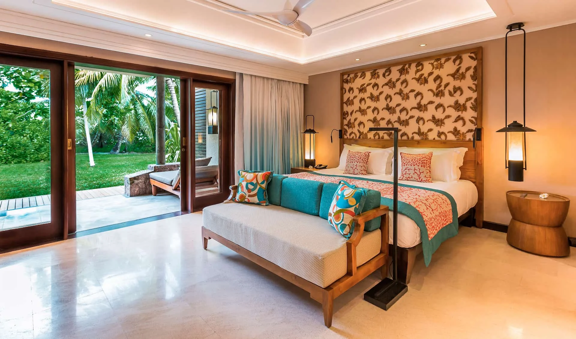 constance lemuria senior suite bed with king-size mattress and tropical-themed decor