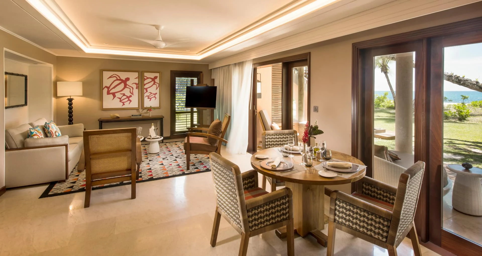 constance lemuria senior suite lounge area with comfortable seating and tropical decor