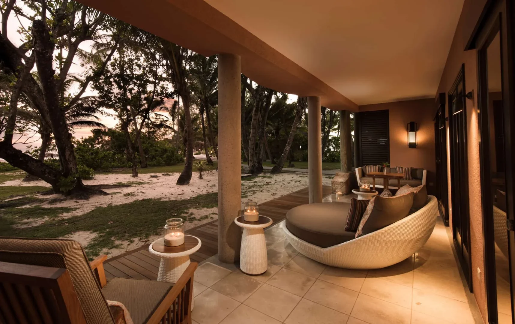constance lemuria senior suite terrace at sunset overlooking ocean and tropical landscape