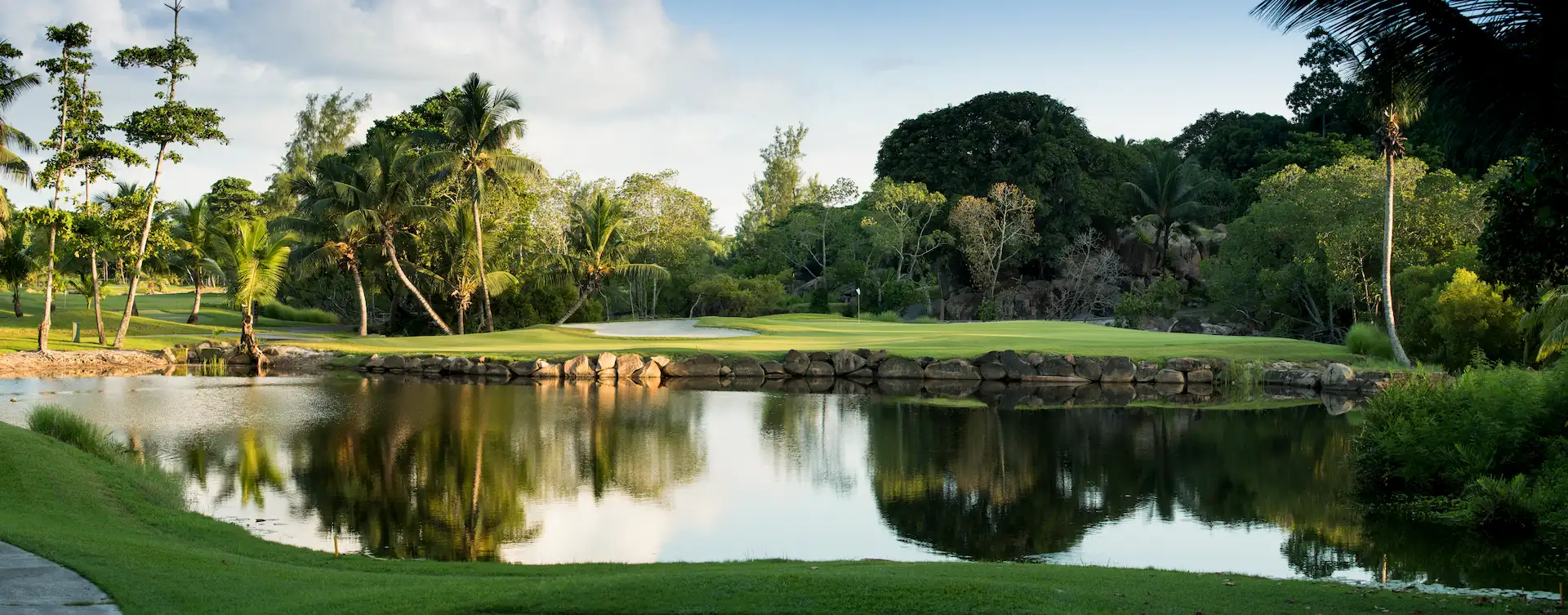 constance lemuria seychelles golf course with lush green fairways and ocean views