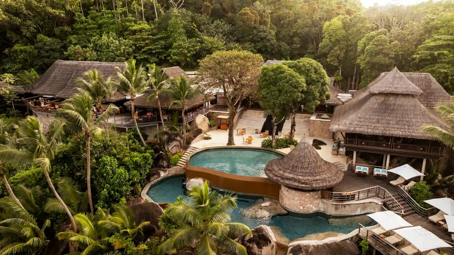 constance lemuria seychelles resort overview with beachfront villas and tropical landscape