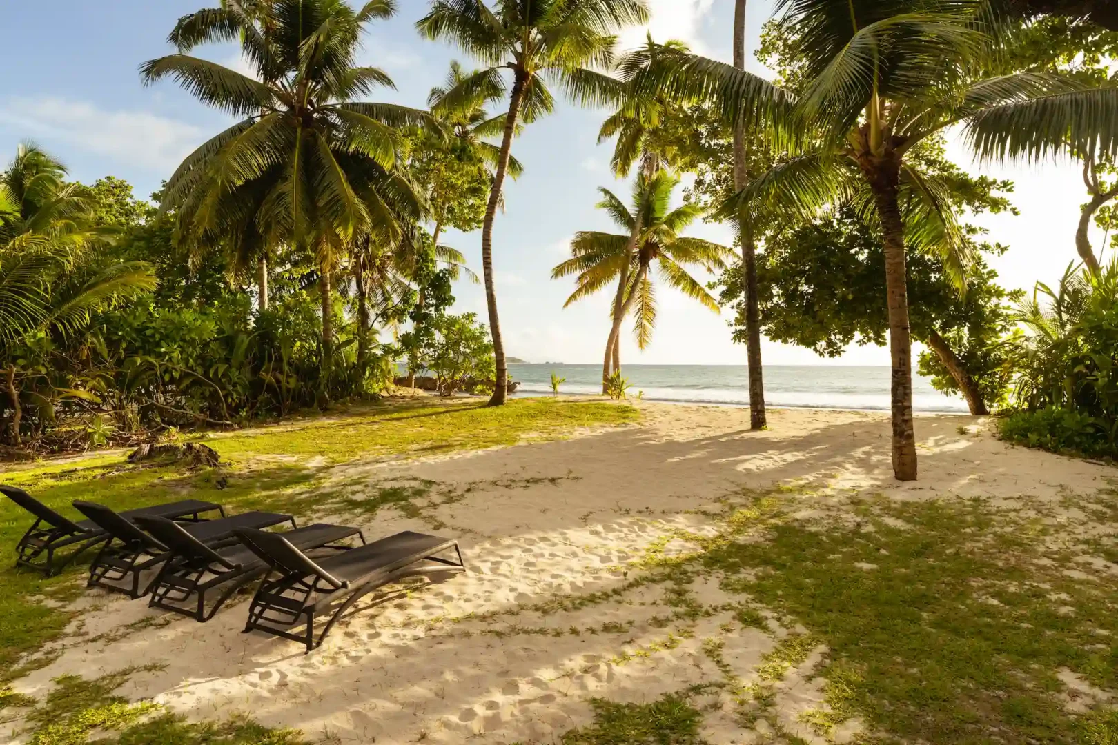 constance lemuria villa on the beach with white sand and turquoise ocean view