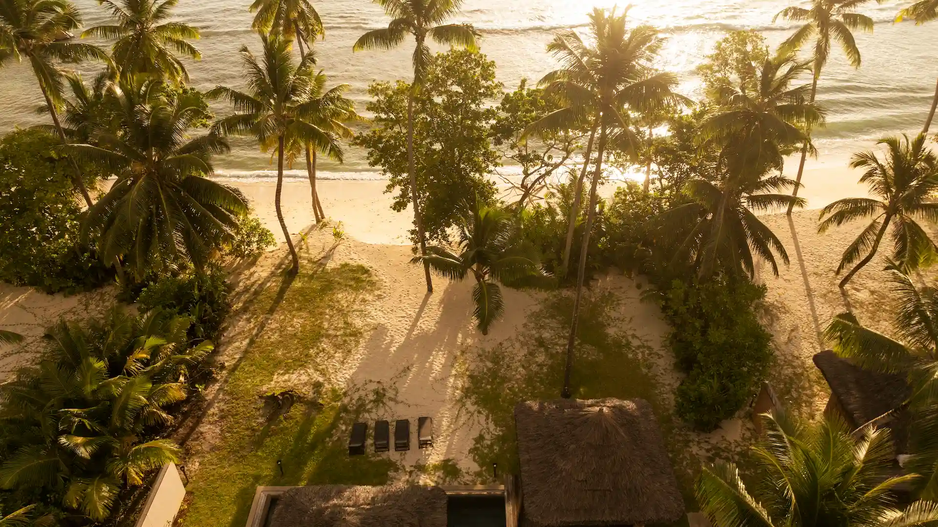 constance lemuria villa at beach during dusk with ocean view and tropical setting