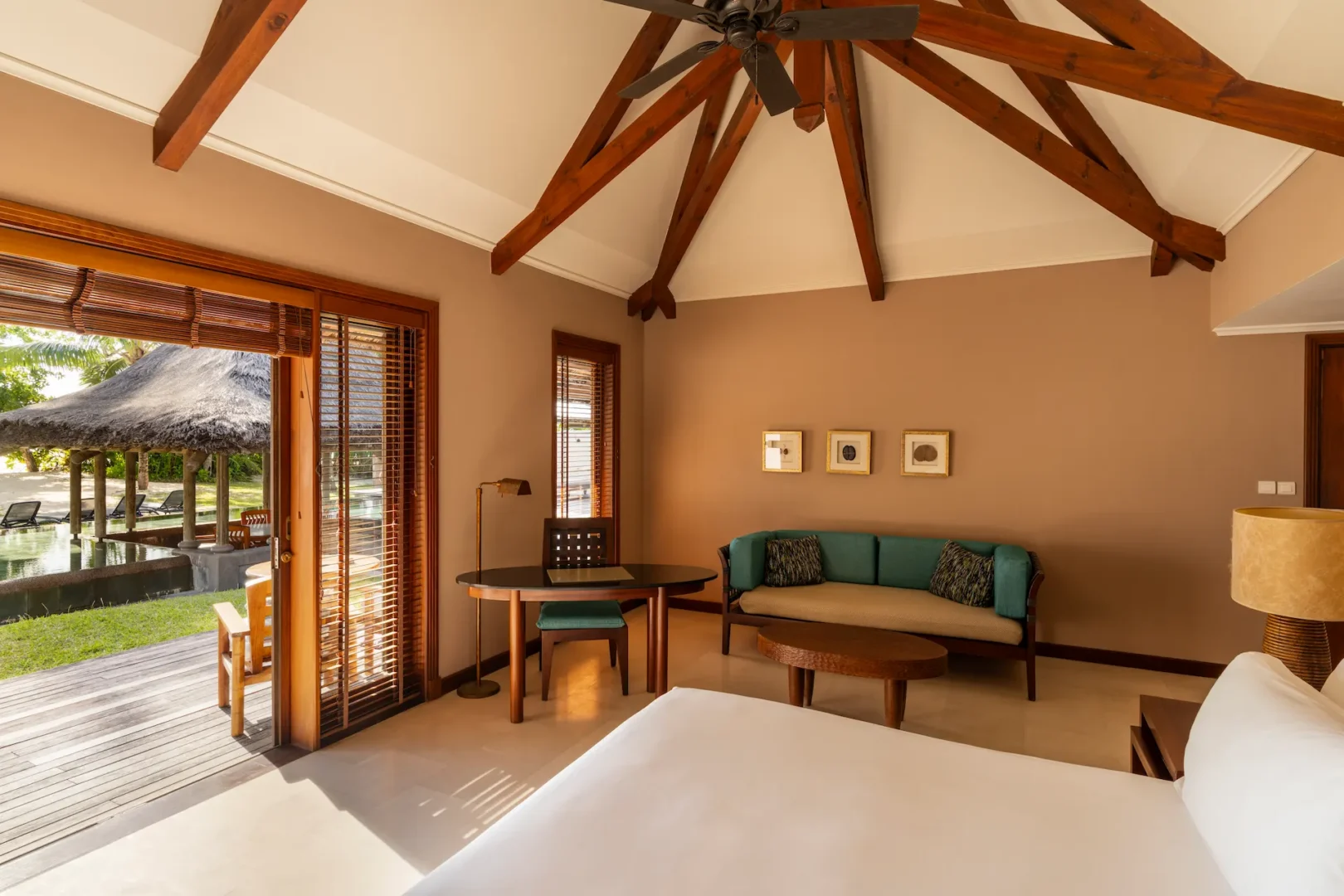 constance lemuria villa bedroom view with king bed and tropical surroundings