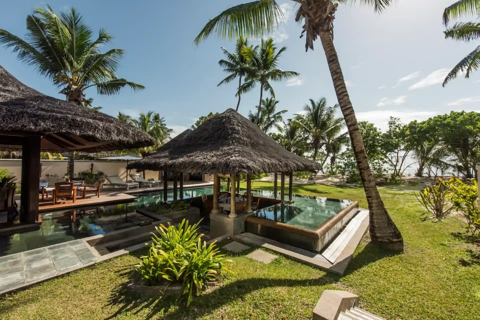 constance lemuria villa private pool with sun loungers and tropical surroundings