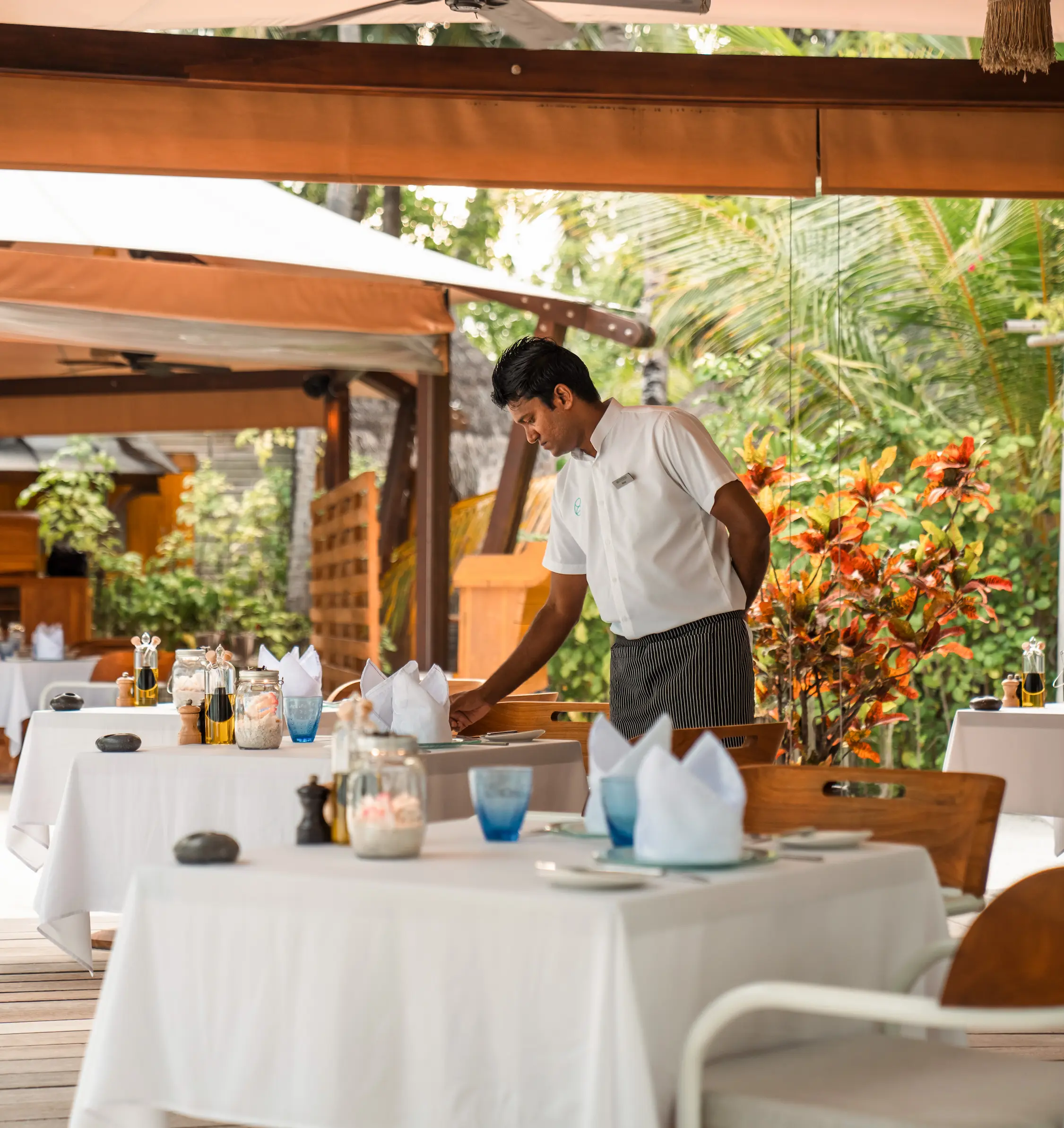 azmeel working as an f b attendant at constance moofushi maldives providing warm island service