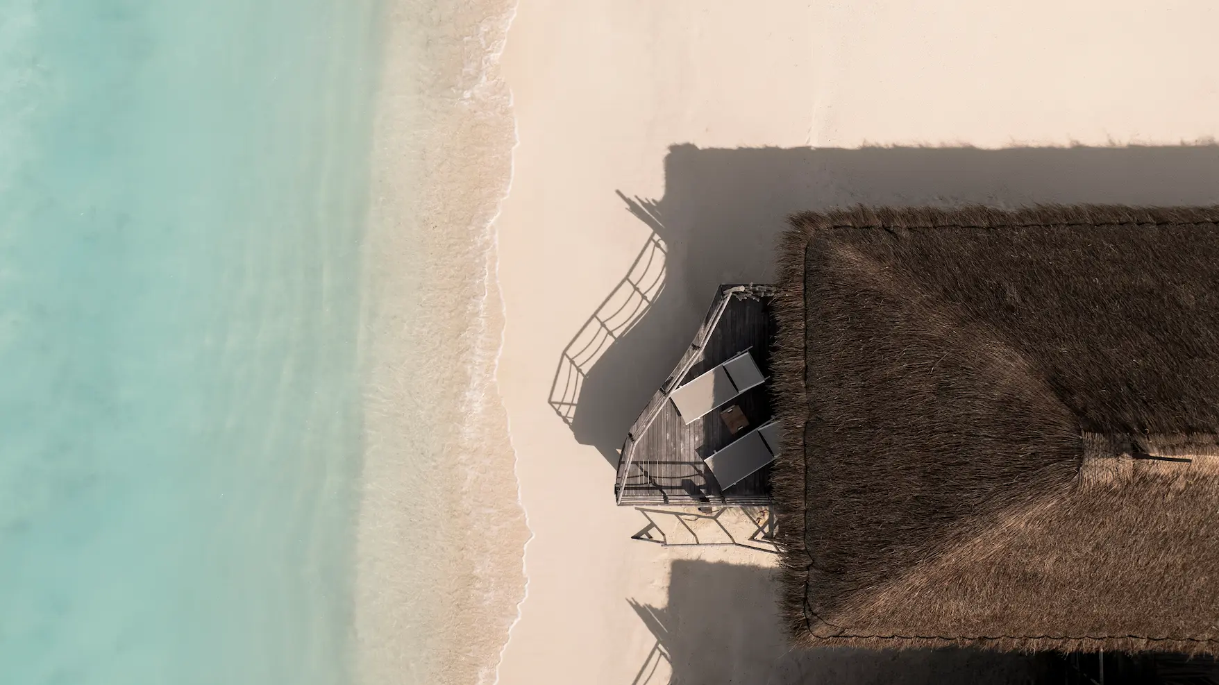 constance moofushi maldives aerial view sand villa