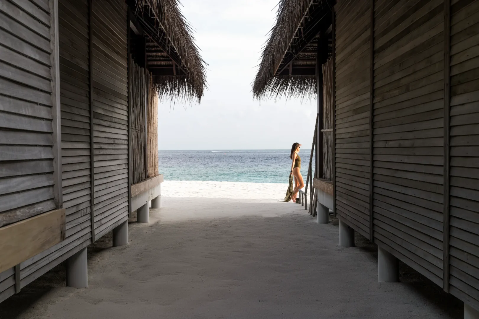 constance moofushi maldives sand villa with a calm beach scene