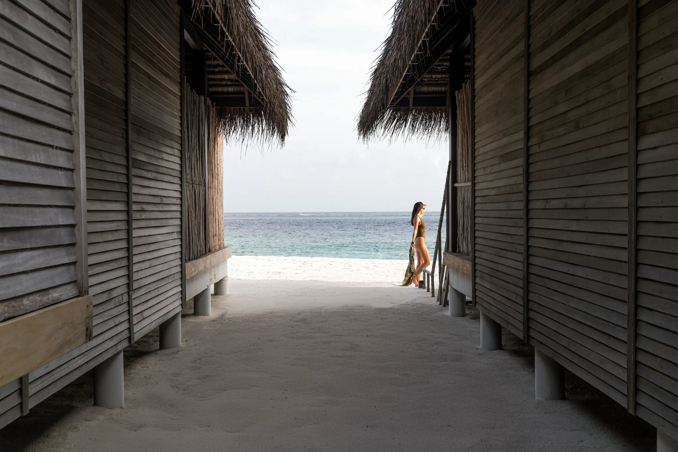 constance moofushi maldives sand villa with a calm beach scene