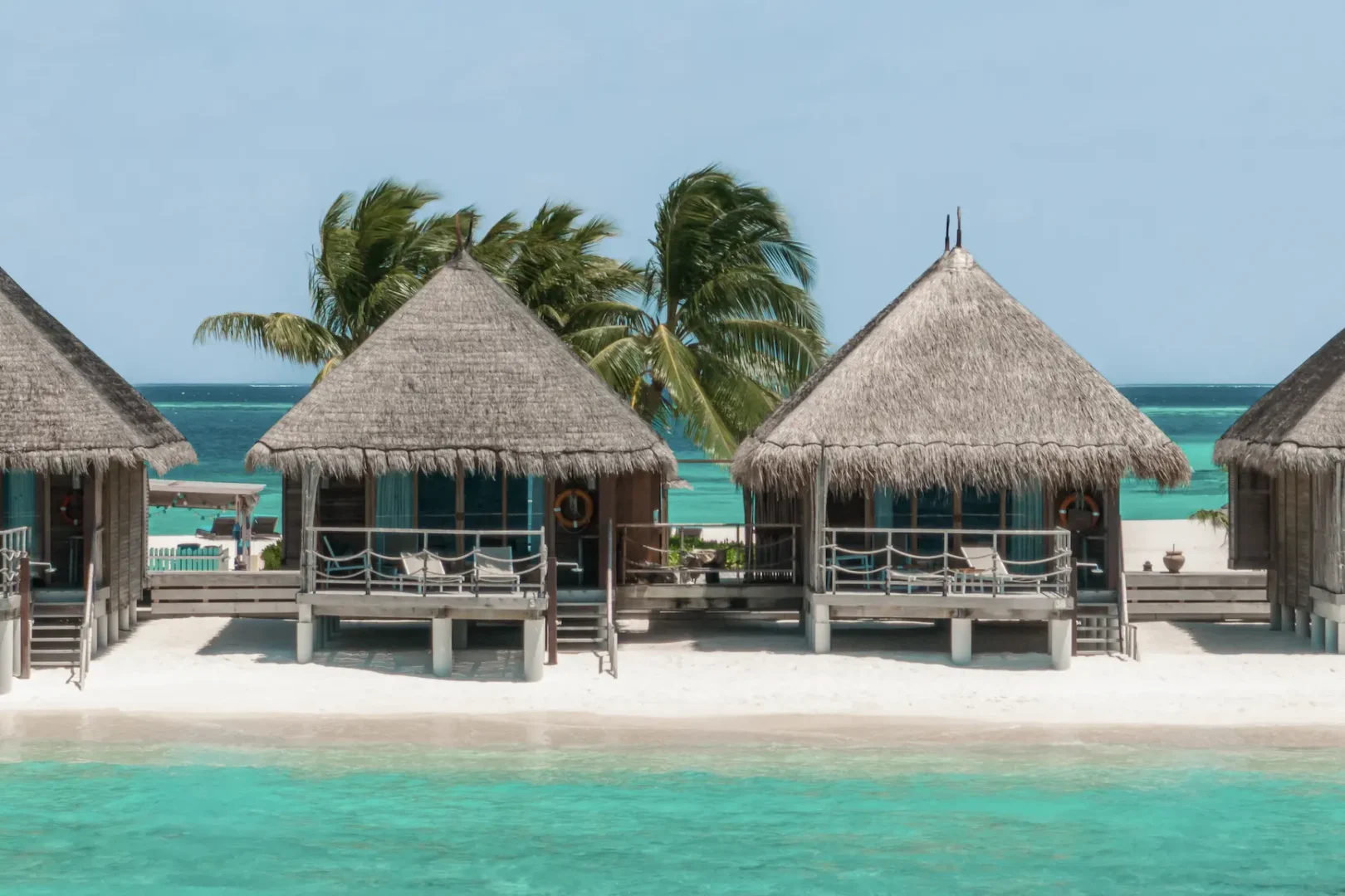 constance moofushi maldives sand villa exterior in a calm tropical setting