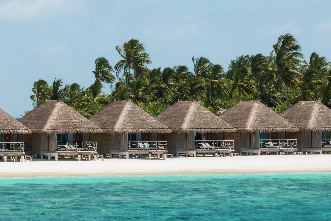 constance moofushi maldives sand villa scene in a relaxing setting