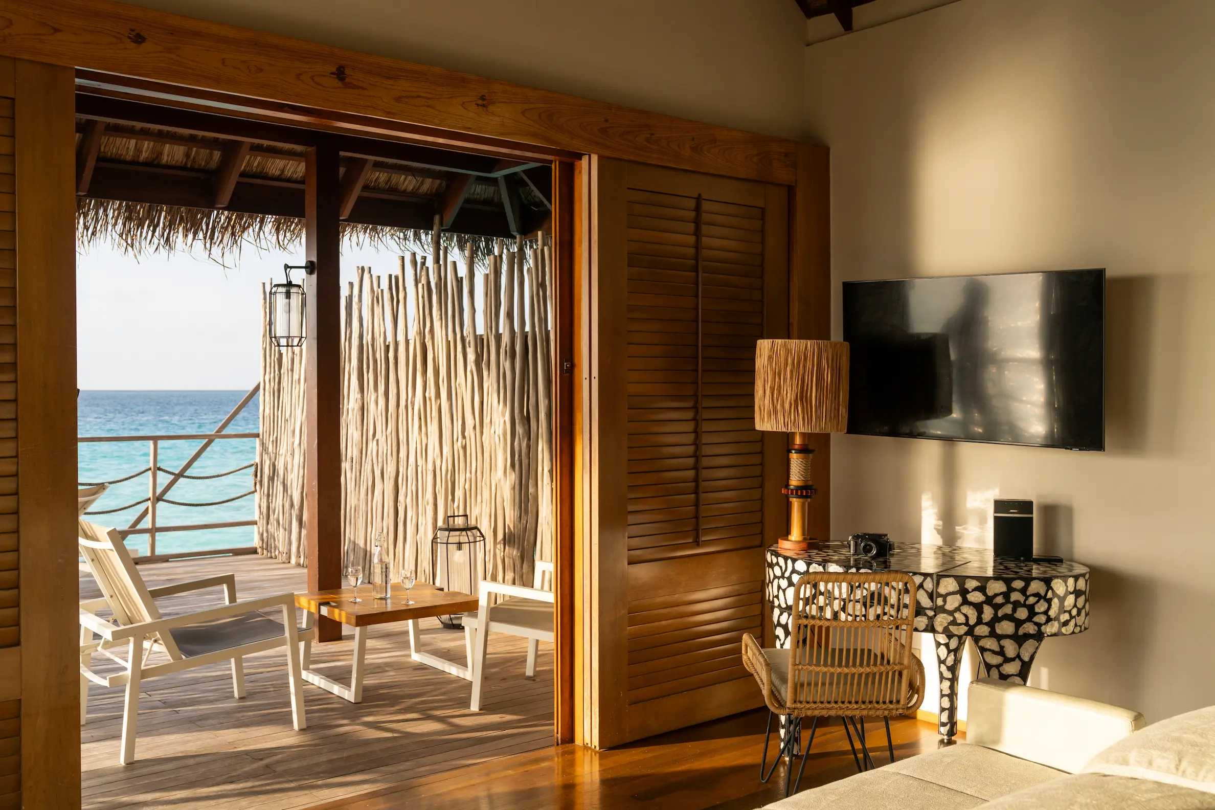 terrace of the senior water villa at constance moofushi maldives with open ocean views