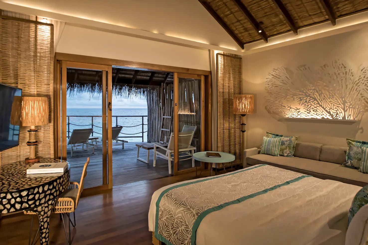 constance moofushi maldives water villa terrace area with a relaxing lagoon outlook