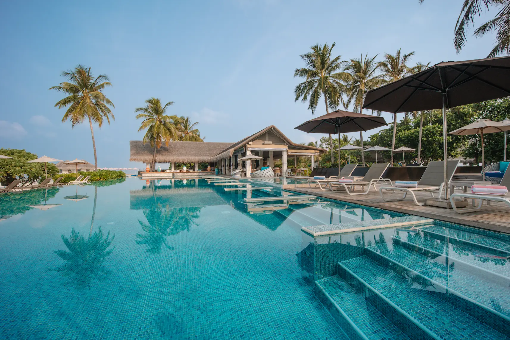 cora cora maldives acquapazza beachfront dining venue with elegant open air design and relaxed maldives island atmosphere