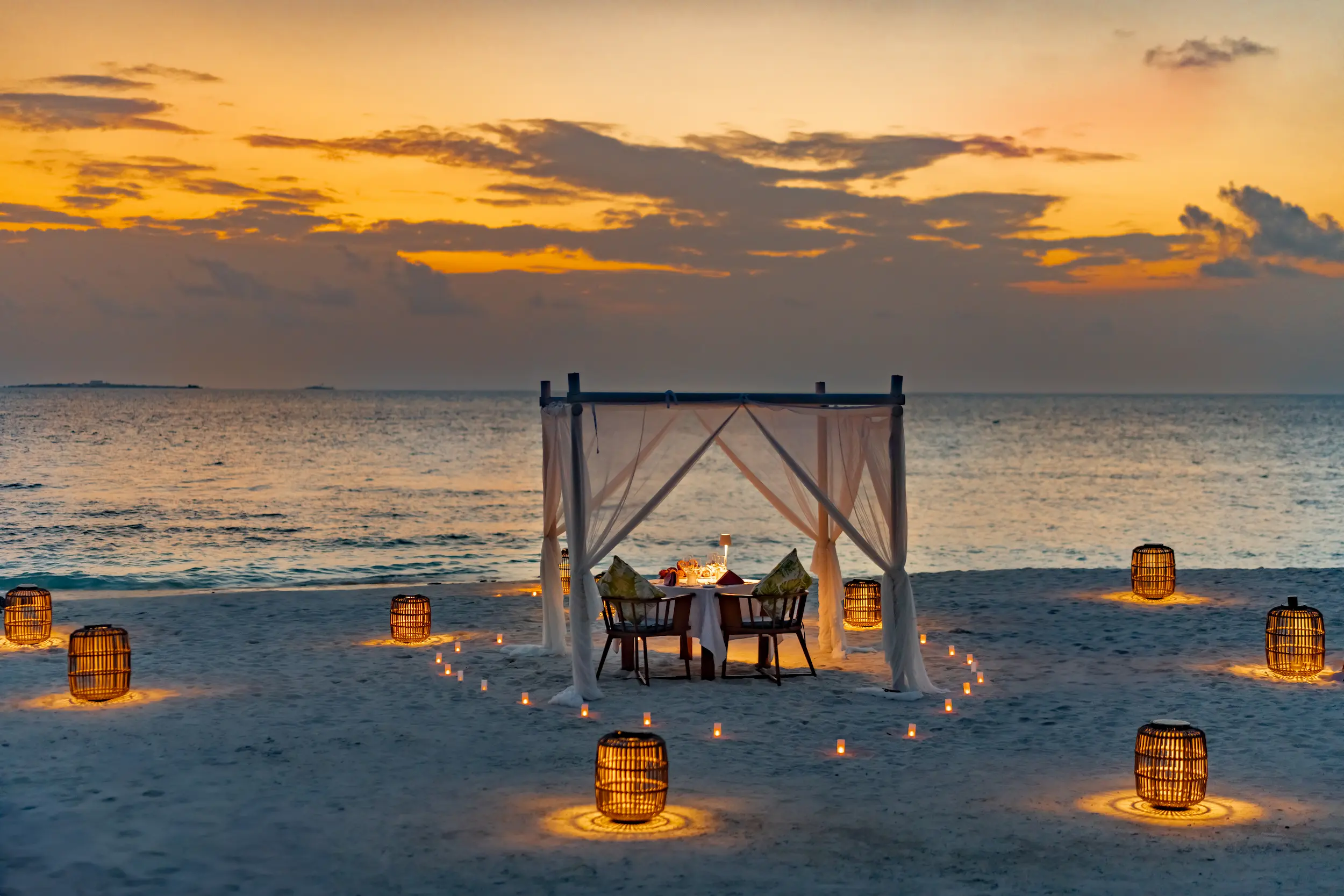 cora cora maldives beach cabana with shaded coastal lounging space soft white sand and serene tropical island ambience
