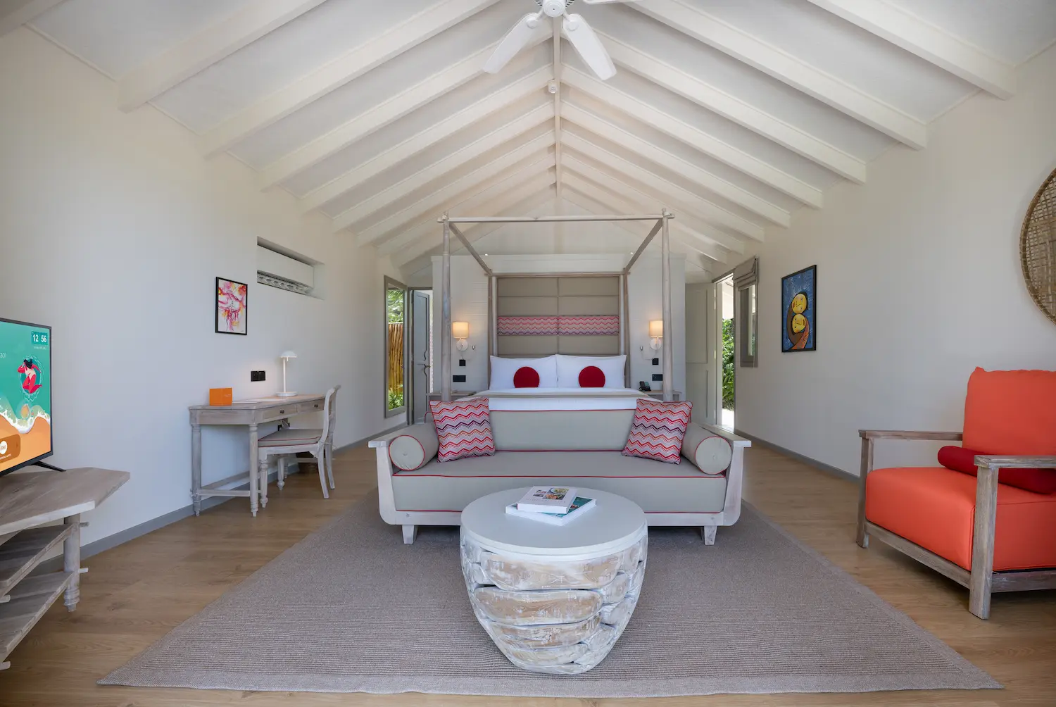 elegant beach pool villa bedroom sofa at cora cora maldives with soft natural textures and a calm coastal atmosphere