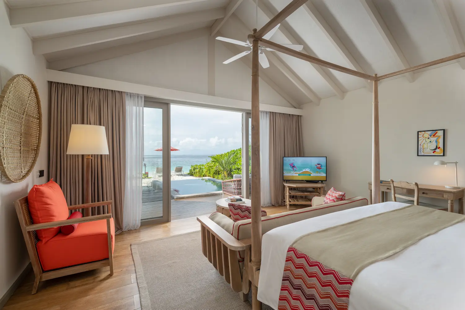 serene beach pool villa bedroom view at cora cora maldives with soft natural light and calming coastal scenery