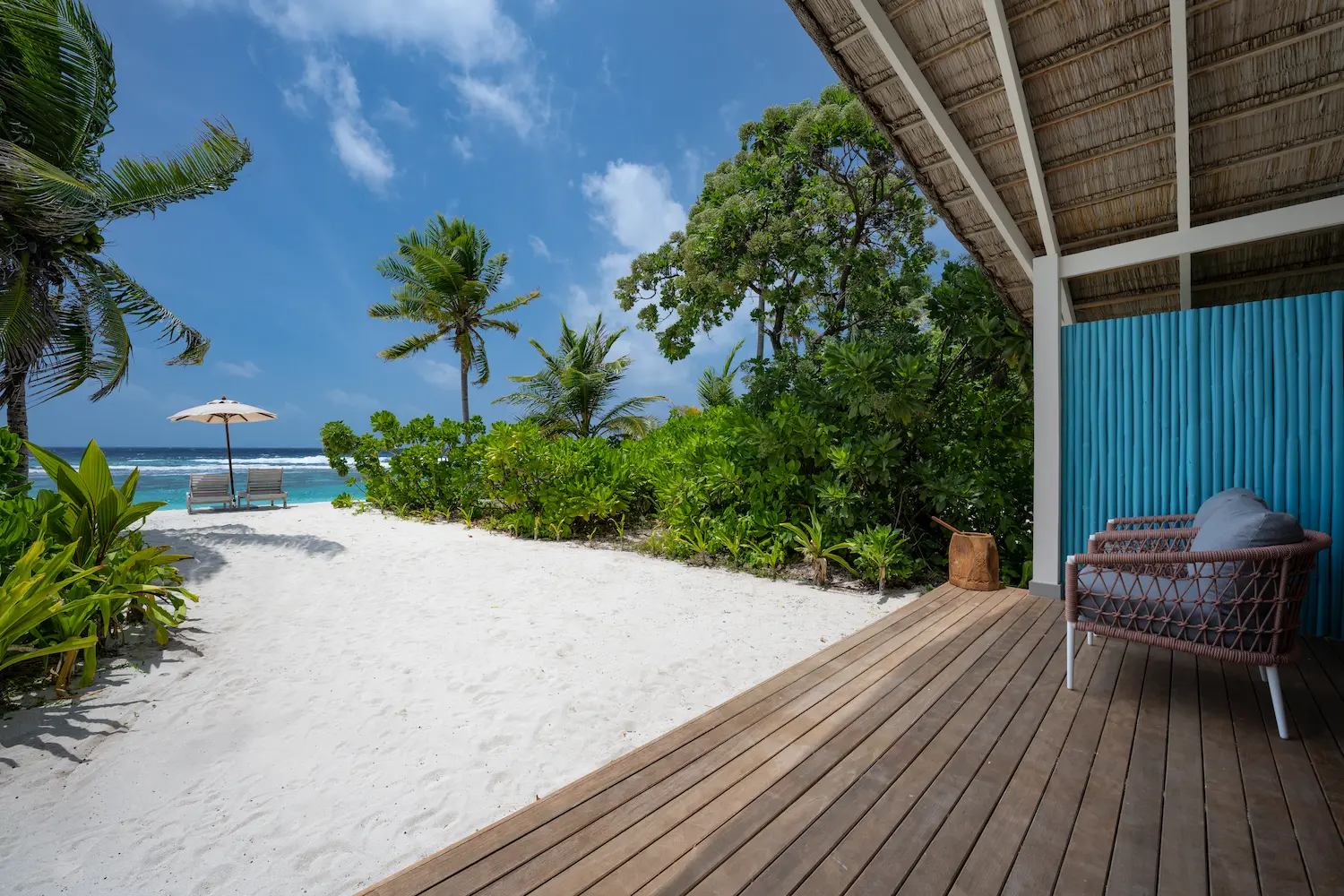 tranquil beach villa beach view at cora cora maldives with soft white sand and vibrant turquoise water
