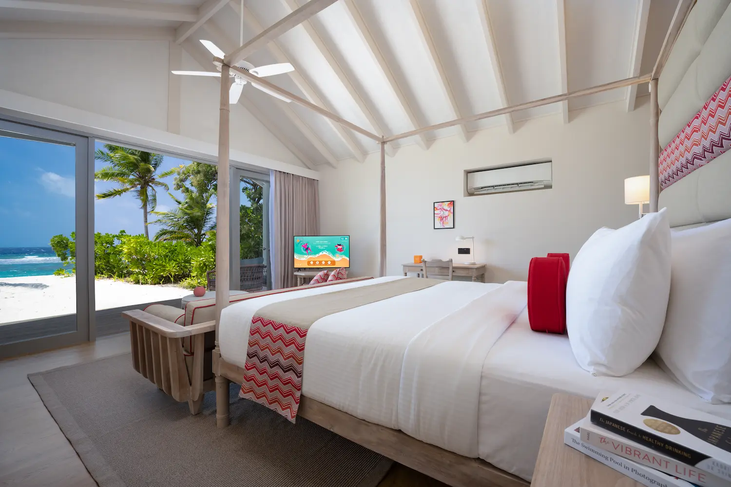 stylish beach villa bedroom interior at cora cora maldives featuring warm natural materials and a relaxed coastal atmosphere