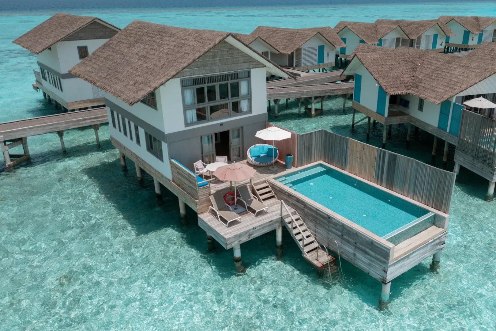 aerial view of the duplex lagoon pool villa at cora cora maldives showcasing its private pool and panoramic turquoise lagoon setting