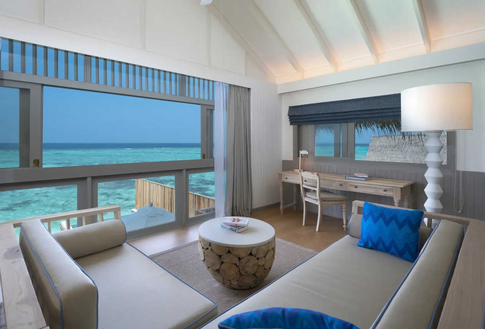 elegant upstairs living room of the duplex lagoon pool villa at cora cora maldives featuring warm natural textures and serene lagoon views