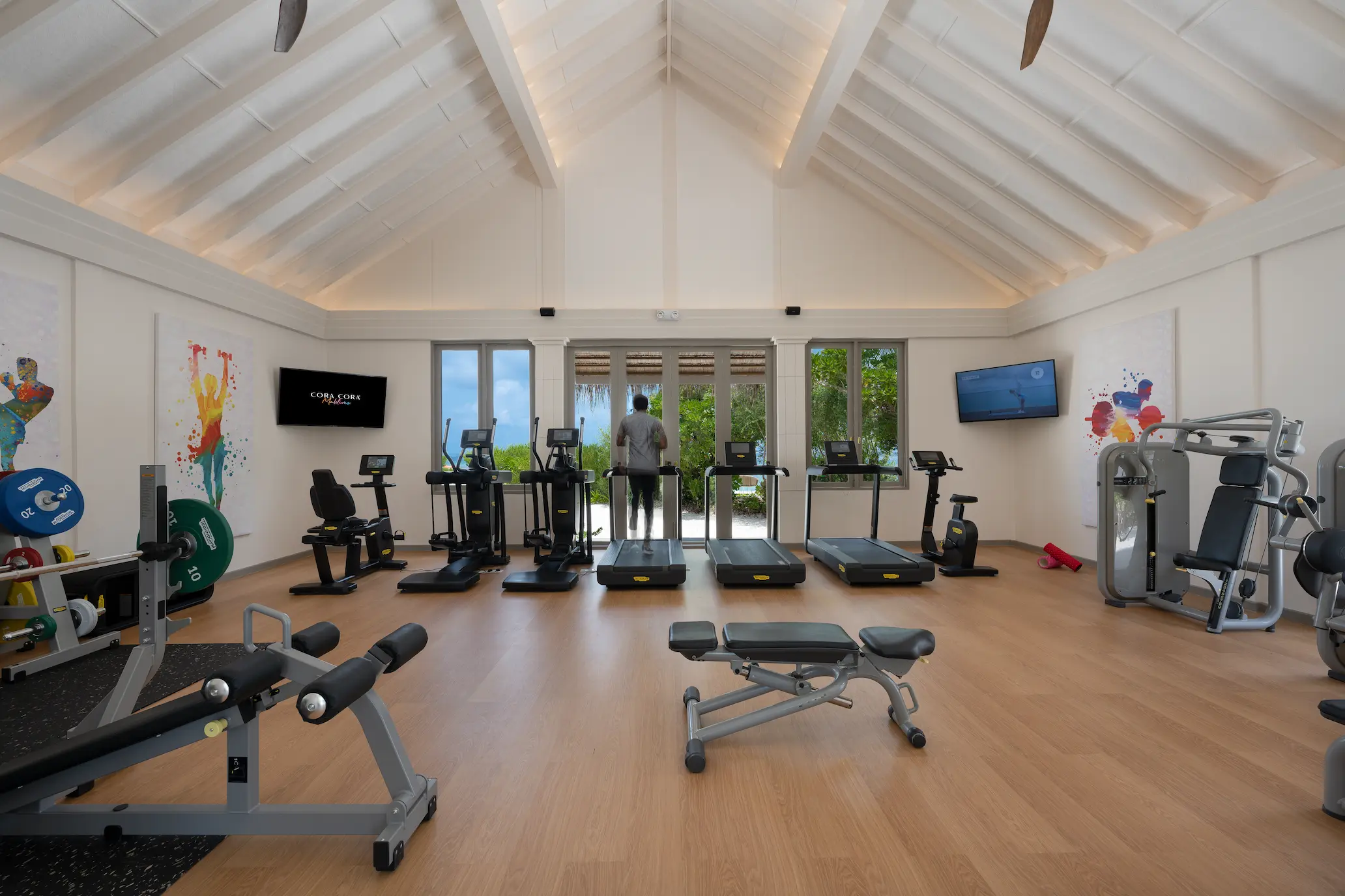 cora cora maldives fitness center featuring modern gym equipment bright island design and an energizing wellness environment