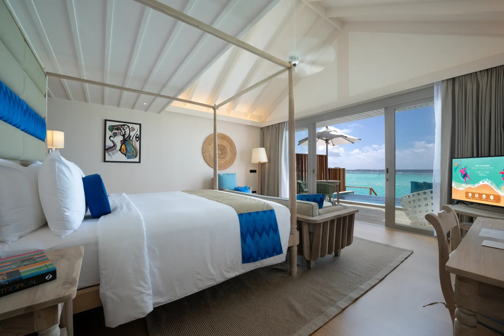 serene lagoon pool villa bedroom bed with a view at cora cora maldives overlooking calm turquoise water and soft natural light