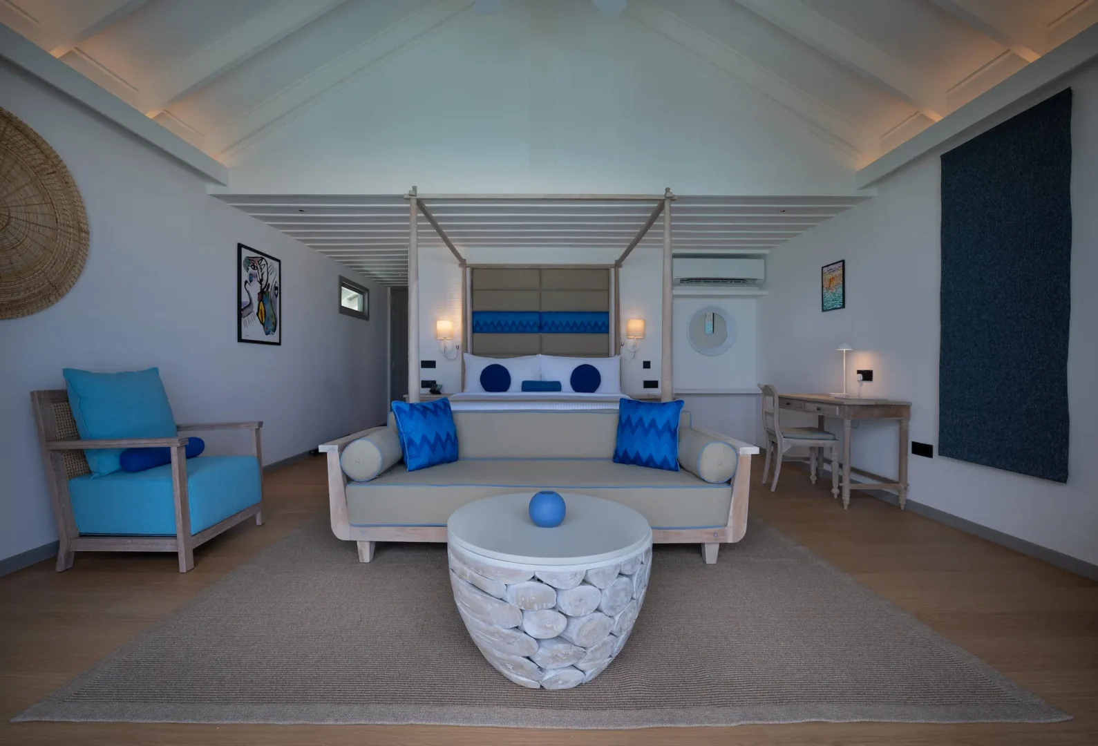 stylish lagoon pool villa bedroom sofa at cora cora maldives with soft natural textures and a relaxed coastal atmosphere