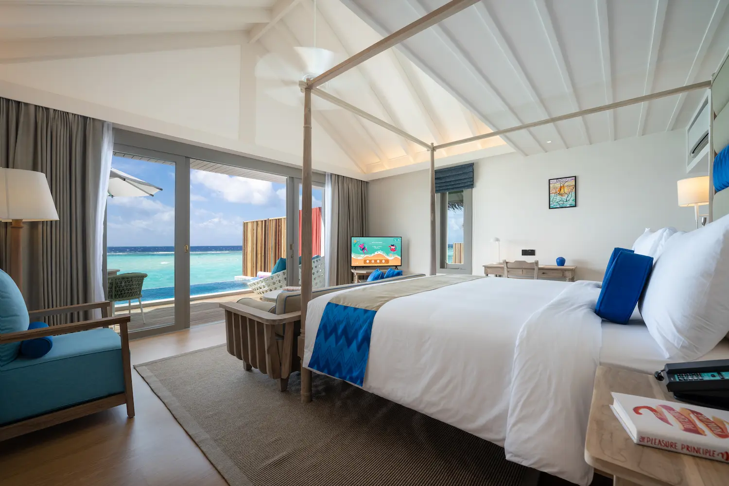 inviting lagoon pool villa bedroom at cora cora maldives featuring warm natural textures and serene coastal ambience