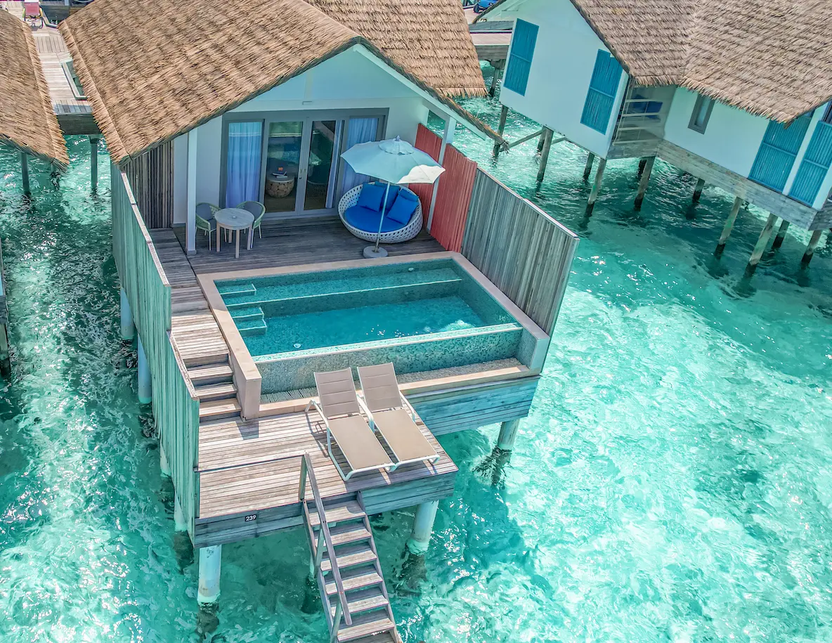 aerial view of the lagoon pool villa facade at cora cora maldives showcasing its private pool and stunning turquoise lagoon setting
