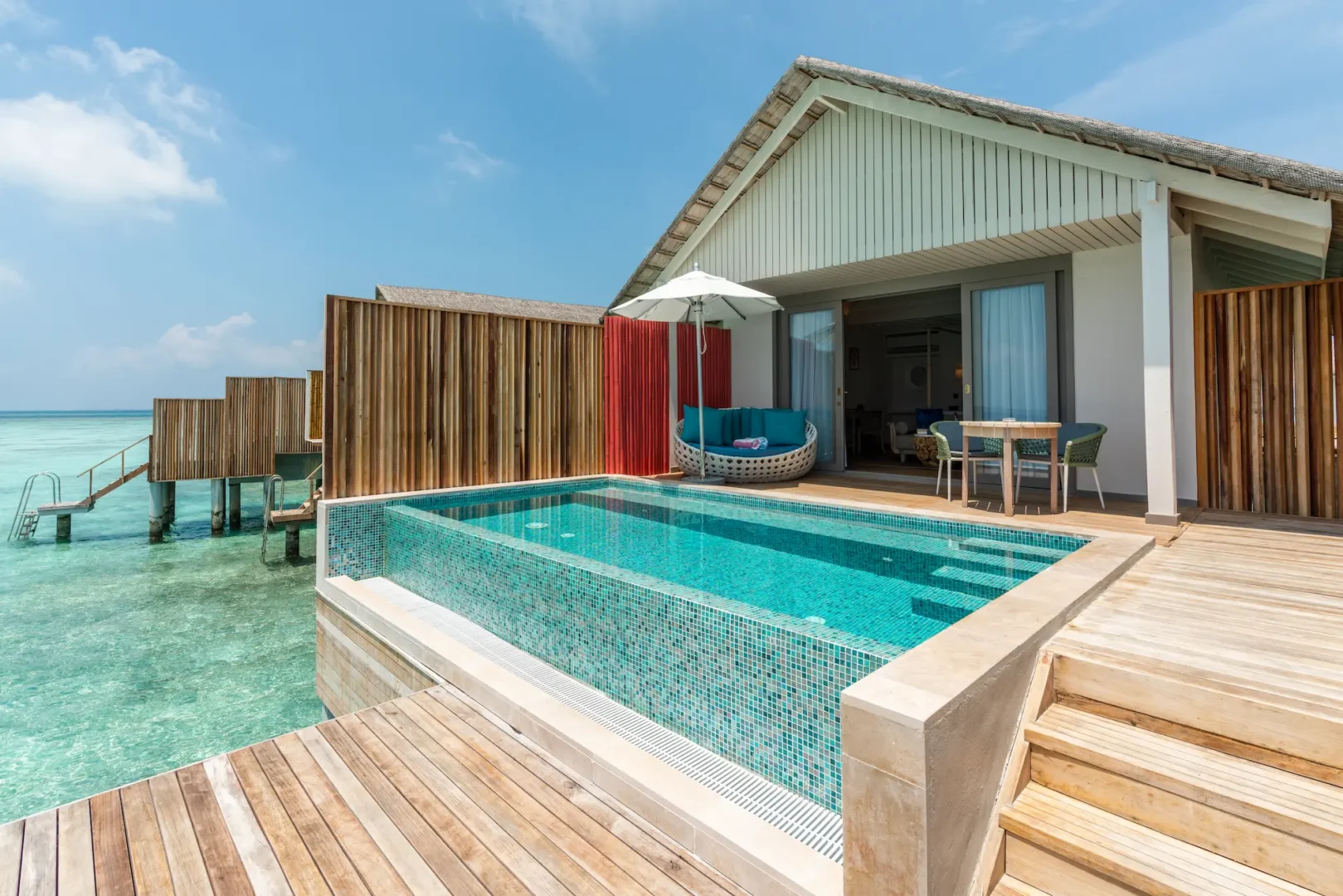 elegant lagoon pool villa facade at cora cora maldives with a tranquil private pool surrounded by tropical scenery