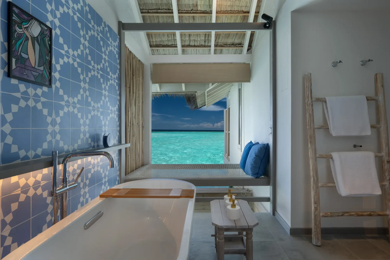 luxury lagoon villa bathroom at cora cora maldives with elegant coastal design