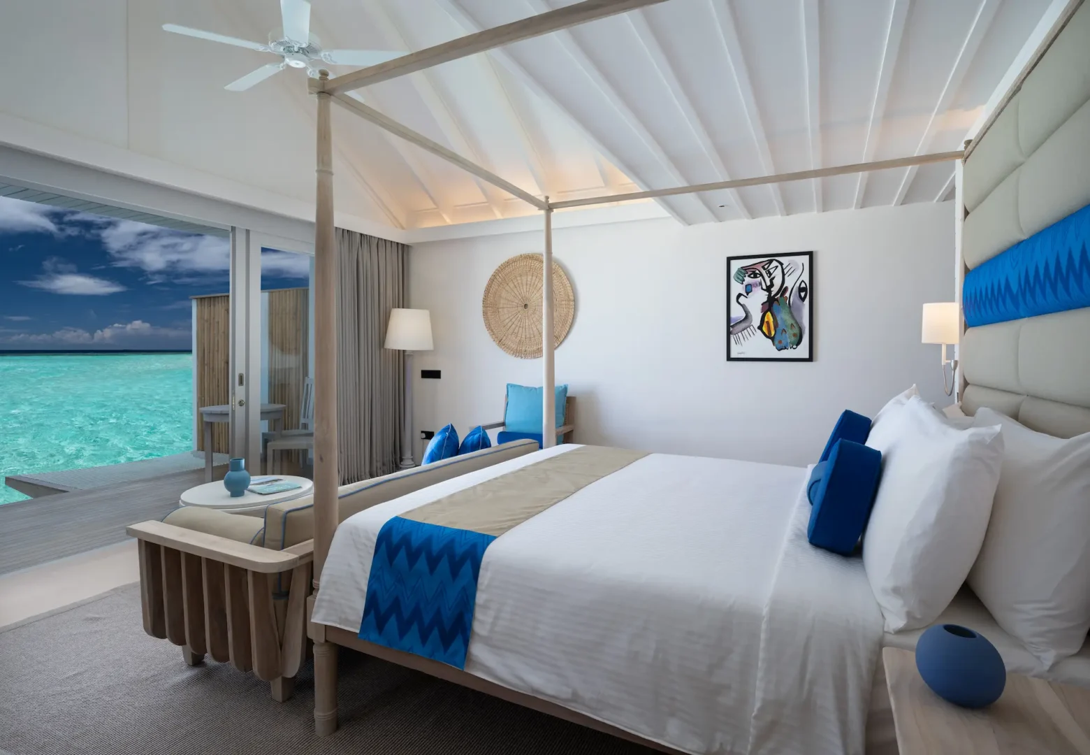 serene lagoon villa bedroom view at cora cora maldives overlooking turquoise water and soft coastal light
