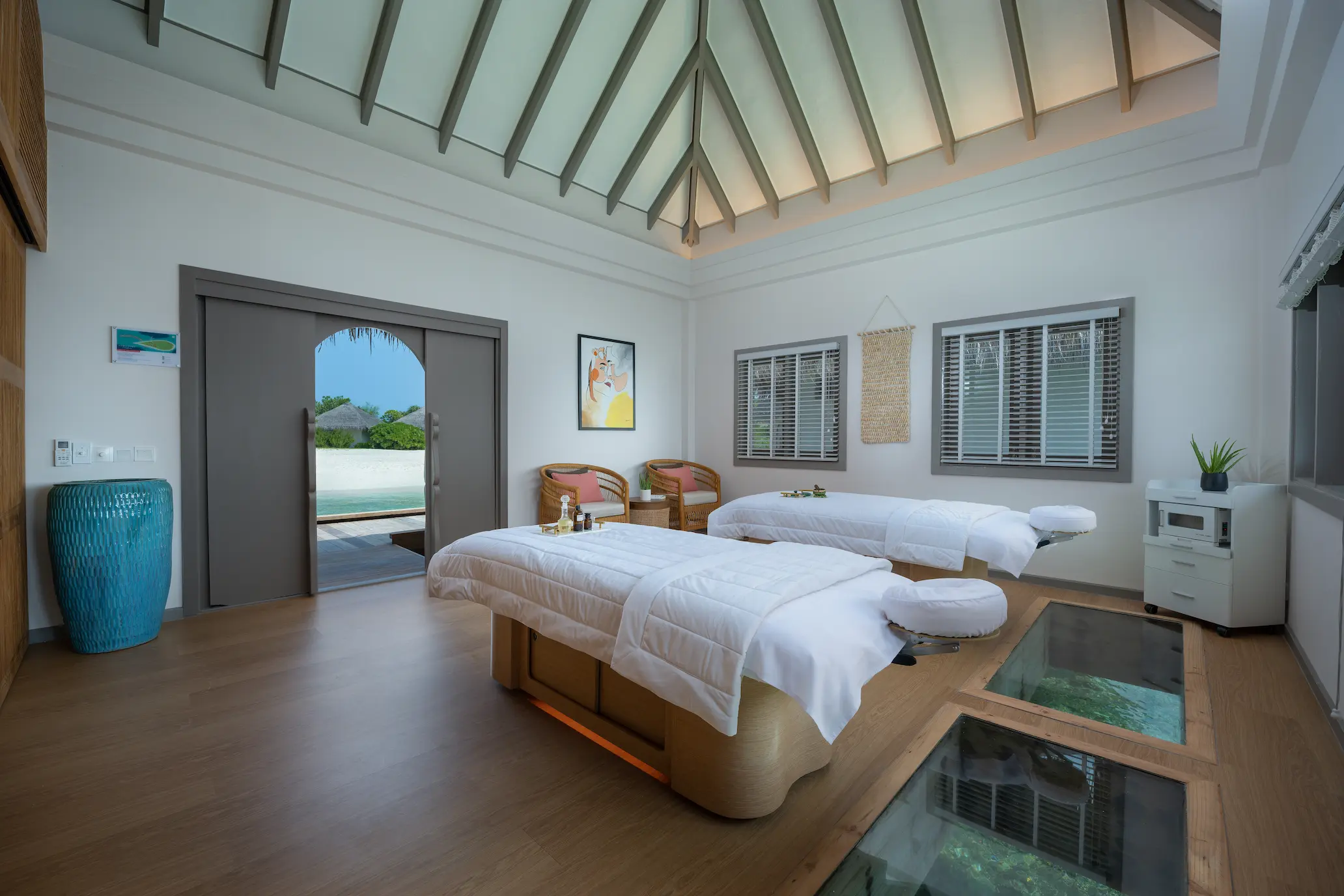 cora cora maldives moksha treatment room featuring serene spa design natural textures and calming maldives wellness ambience