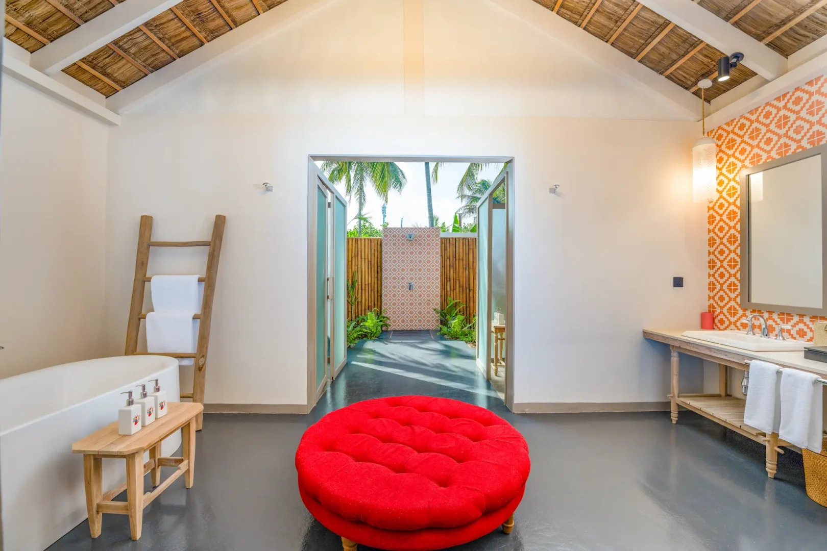 luxurious master bathroom of the two bedroom beach pool suite at cora cora maldives featuring elegant natural finishes and serene coastal lighting