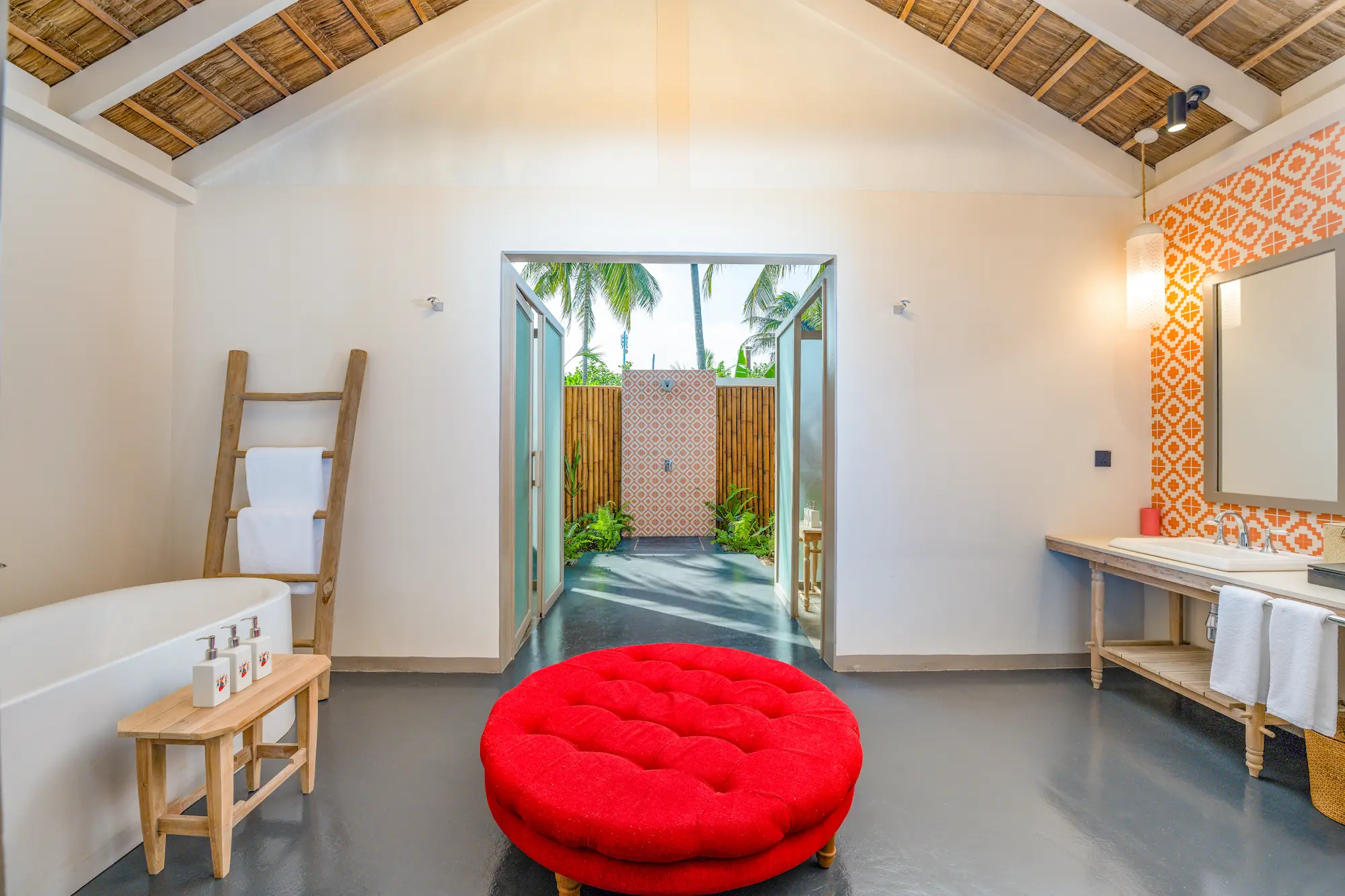 luxurious master bathroom of the two bedroom beach pool suite at cora cora maldives featuring elegant natural finishes and serene coastal lighting