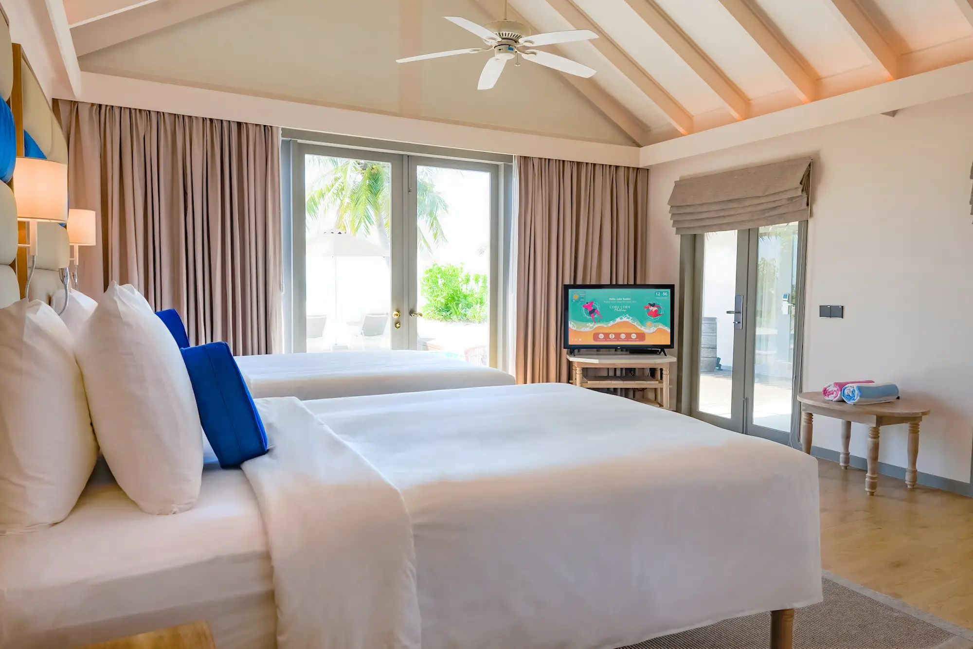 bright twin bedroom of the two bedroom beach pool suite at cora cora maldives featuring soft natural tones and a relaxed coastal atmosphere