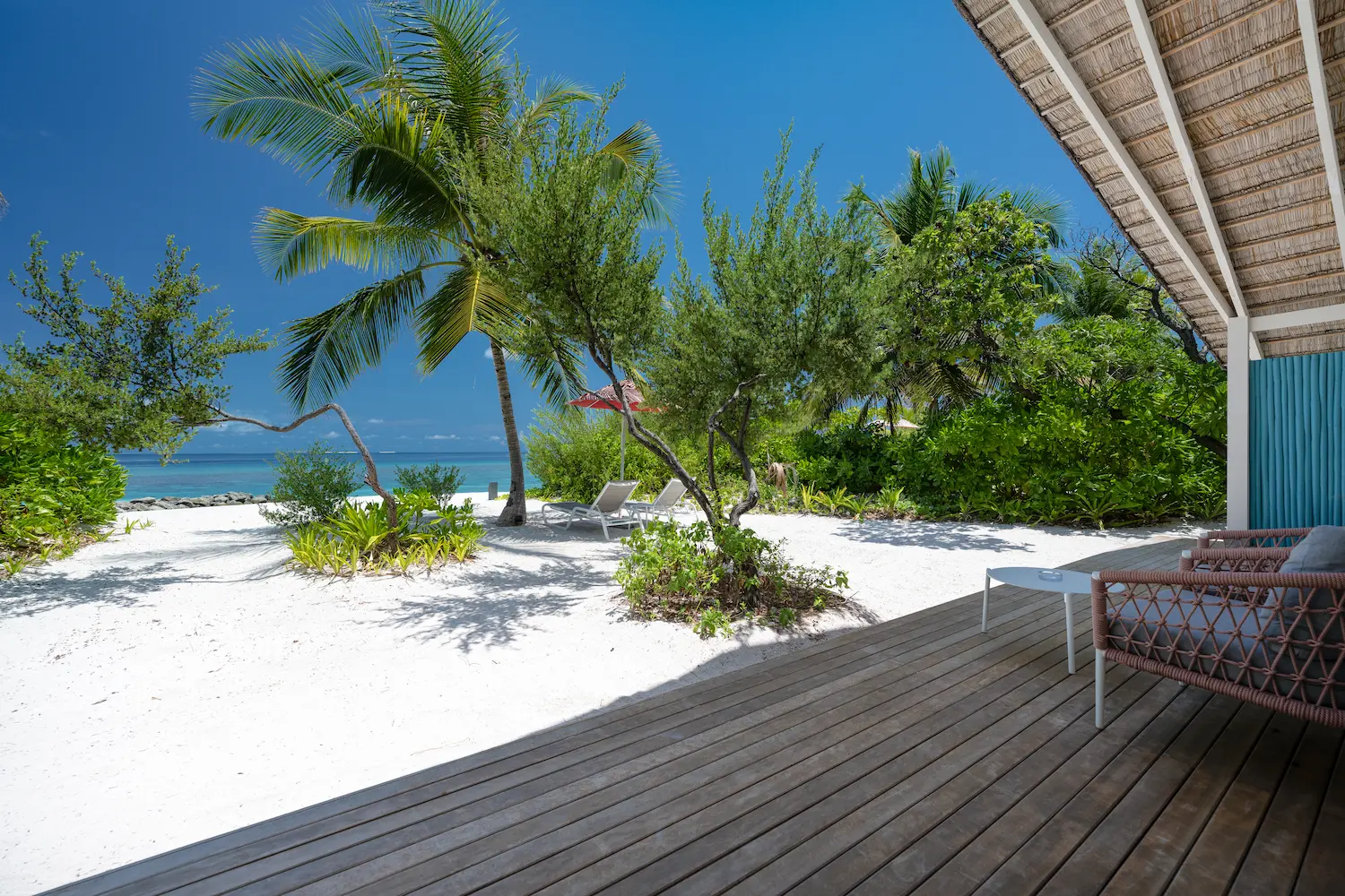 spacious terrace of the two bedroom family beach villa at cora cora maldives featuring relaxed outdoor seating and serene coastal views