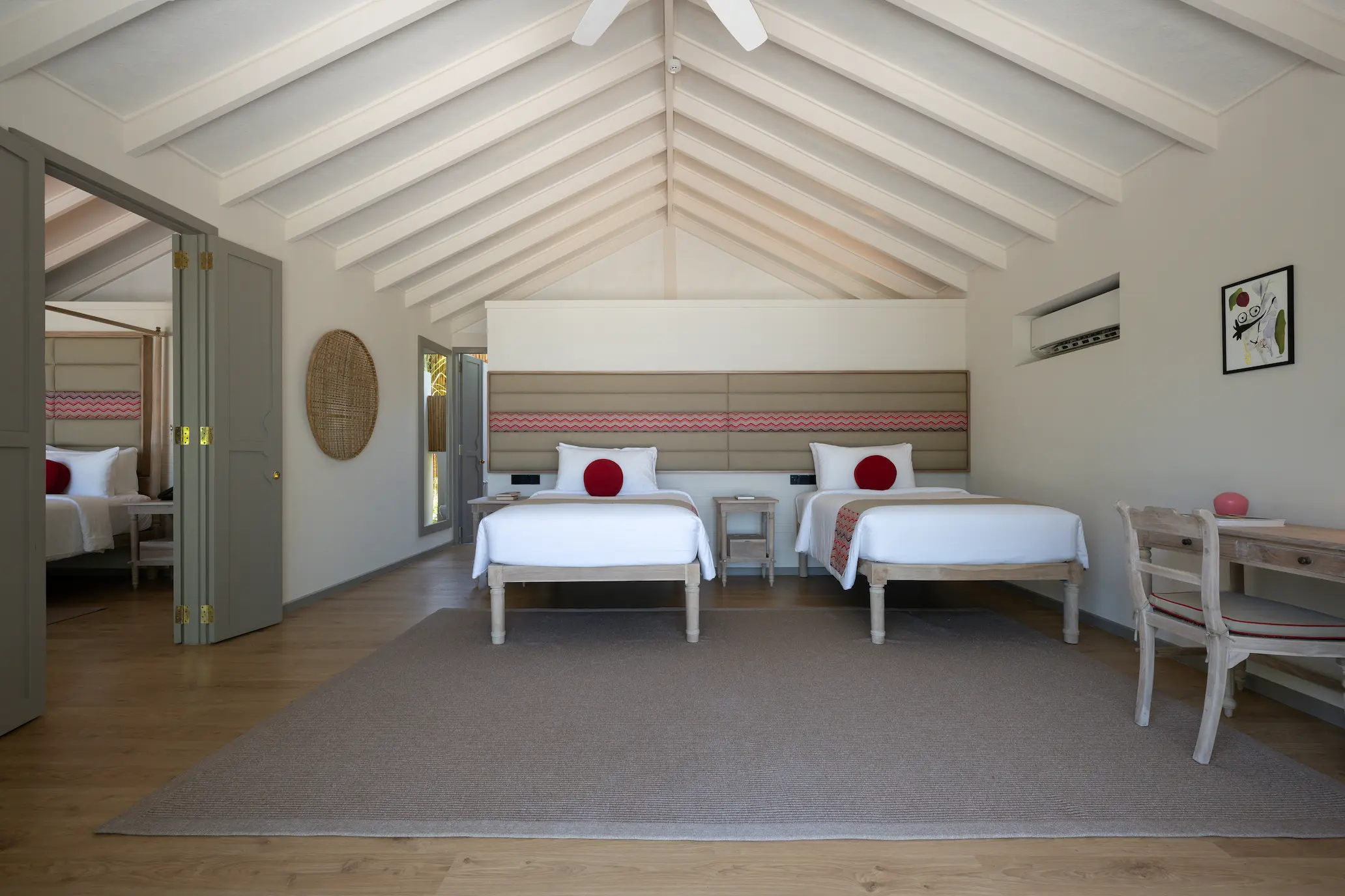 twin bedroom of the two bedroom family beach villa at cora cora maldives featuring soft natural textures and a calm family friendly atmosphere